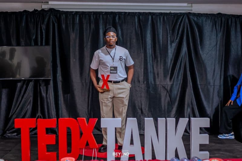 Tomide Williams with his TEDxTanke speaker trophy